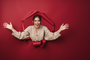 Caucasian young happy woman smiling and throwing up her hands