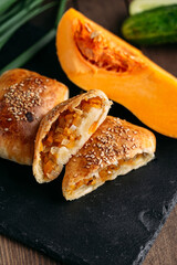 Cut oriental dish baked pie with chicken meat samsa