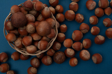 sprinkled nuts lie on the table and in a basket