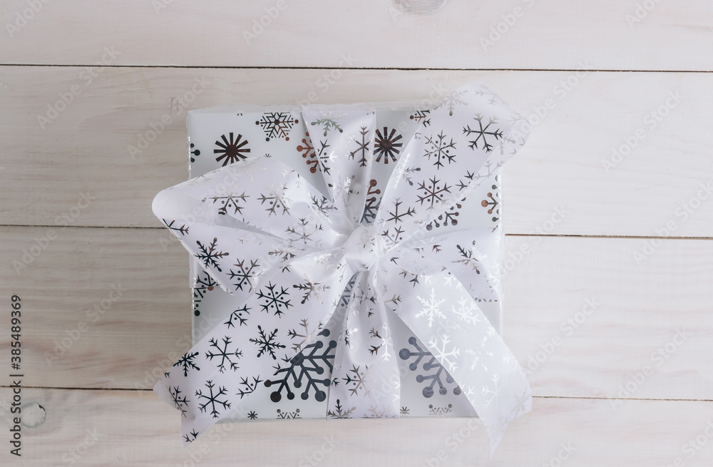 Wall mural Christmas Decorations and a Gift Box. Christmas White background. Flat lay.