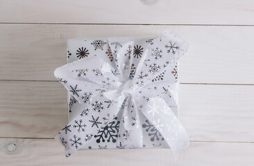 Christmas Decorations and a Gift Box. Christmas White background. Flat lay.