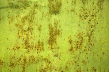 Green paint and rust on the old iron. Background, texture.