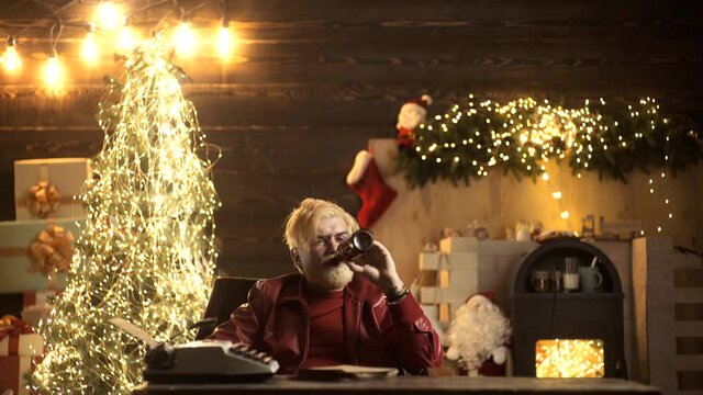 Drunk bad santa. Lonely friendless Christmas holidays concept. Sad young male drink beer on christmas tree.