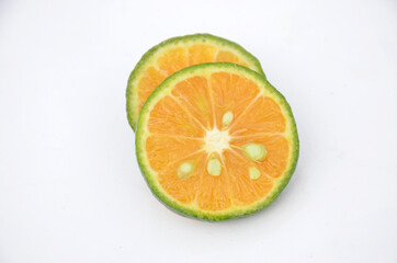 sliced orange fruit isolated on white background.