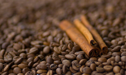 Roasted coffee beans. Cinnamon sticks