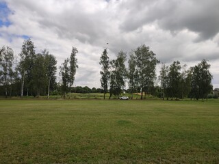 large soccer field with green grass in summer © dyachenkopro