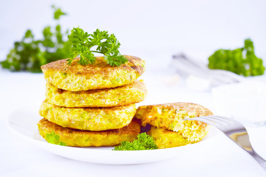Fresh made chick peas pancakes with parsley and sour cream,delicious snack,Vegetarian chick pea burger,Indian chick-peas burger