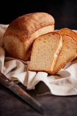 Assorted different types of bread, gluten-free bread, close-up on a dark background. French...