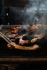 Pieces of meat on a restaurant grill