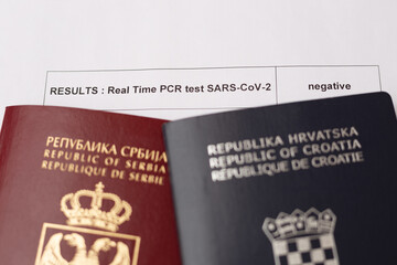 Passports of Serbia and Croatia with the negative SARS-CoV-2 (Covid-19) examination results.