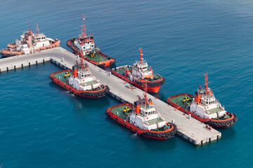 Tug boats moored in a port. Aerial view