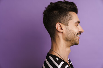 Fototapeta premium Photo in profile of happy man laughing and looking aside