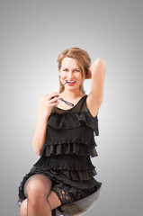 Fototapeta premium a beautiful woman posing and smiling coquettishly