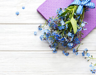 Forget-me-not flowers and notebook