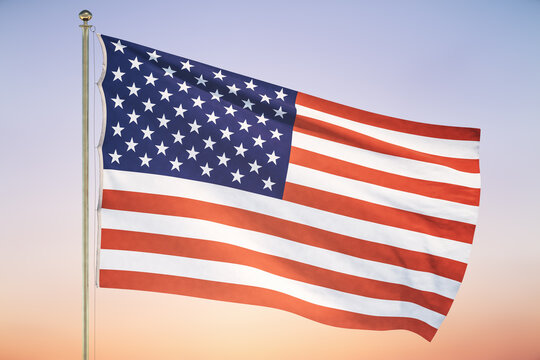 US flag on sunset sky background