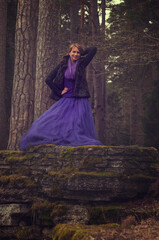 Fototapeta premium woman in forest with violet dress