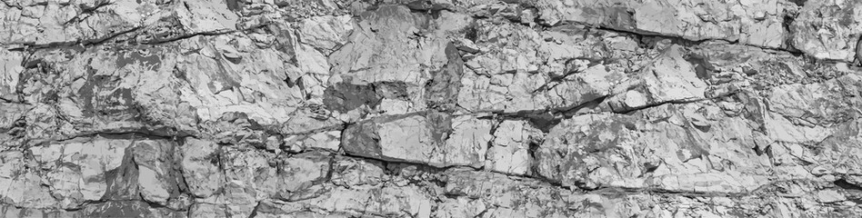 Solid particles fragments, gaps split, cavity, groove track on sharp stones. Debris pieces, scratch marks on cut ruined rock blocks.Gray dirt bump map, old grunge steep cliff for 3d grayscale backdrop