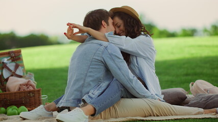 Joyful man and woman hugging outdoors. Happy girl and guy spending time in park