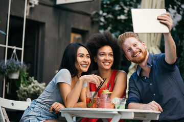 Young friends having a great time together. Group of people talking and smiling.