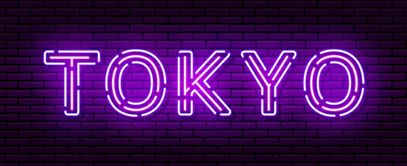 Fototapeta na wymiar Glowing neon sign with the inscription of the Japan city of Tokyo. In blue and purple colors. Against a brick wall.