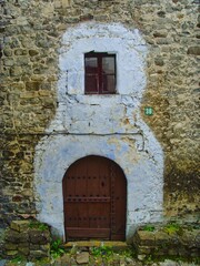 Old house door in the countryside painted white