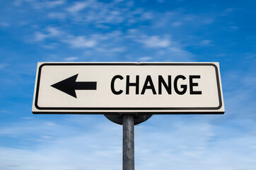 Change road sign, arrow on blue sky background. One way blank road sign with copy space. Arrow on a...