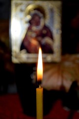 Burning wax candle religious background. Christian and spiritual concepts.