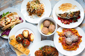 Flat lay of a lunch or dinner selection of meatball dishes