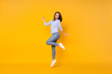 Fototapeta na wymiar Full length body size view of her she attractive pretty lovely cheerful cheery girl jumping having fun good mood healthy comfort life isolated bright vivid shine vibrant yellow color background