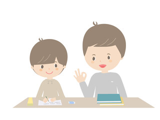 Boy doing homework with his father