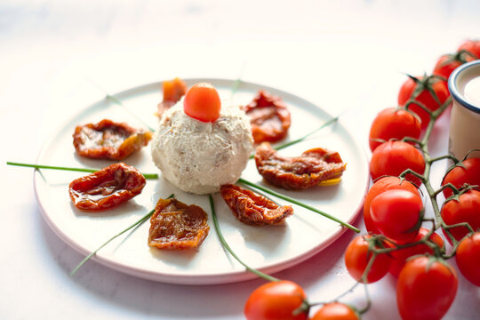 Delicious rustic breakfast - farm boursin goat cheese with sun-dried tomato,shallot onion and fresh cherry tomatoes