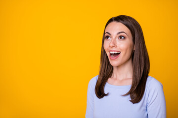 Photo of astonished positive cheerful girl look copyspace impressed wonderful bargain novelty ads wear shirt isolated over bright color background