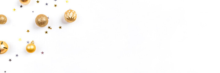 Festive white background with gold Christmas decorations. Flat lay, top view. Copy space for text.