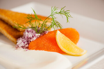 Starter dish Beautifully presented with whitefish caviar, toasted bread and lemon slice