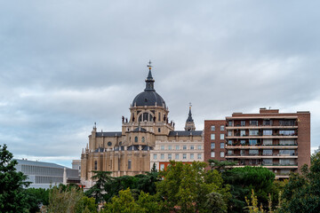 Skyline of Almudena Cathedral of Madrid. Exterior view from Vistillas Park at sunset