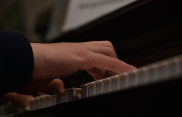 Fototapeta na wymiar hands of a person playing piano