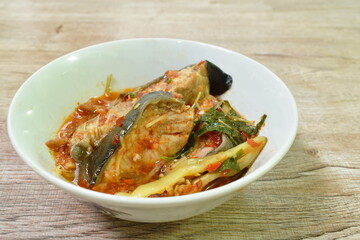 spicy fried catfish with finger root and chili in curry on bowl