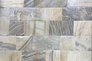 Natural marble stone wall.
Wall of fine stone tiles for wallpaper.
12th century marble cubes.