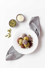 Granola raw energy balls on a plate, top view