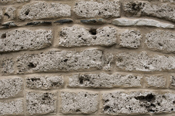 Stone wall texture.
Serbian rural house wall made of natural stones background. Close up on stone wall surface.