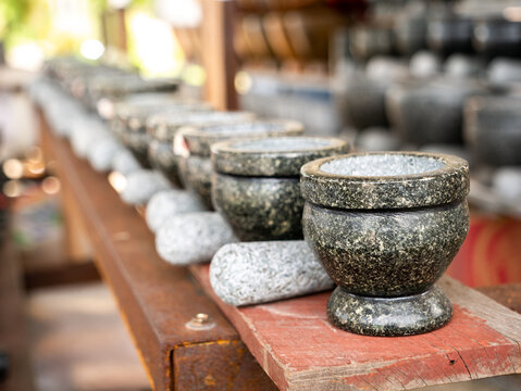 Stone Mortar and Pestles Arranging in Rows