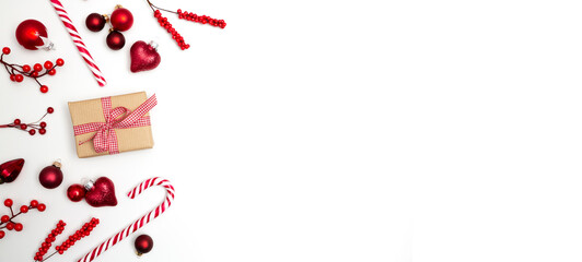 Fototapeta na wymiar White Christmas background banner with gift box, candy cane and christmas ornaments