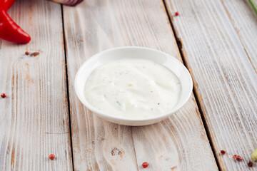 Side view on white sour cream sauce