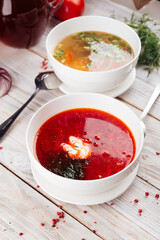 Closeup on two soups borsch and vegetable
