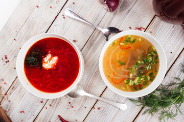 Top view on two soups borsch and vegetable