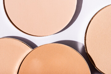 close up view of face powder on white background