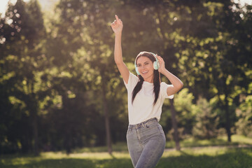 Portrait of her she nice attractive pretty lovely cheerful cheery carefree girl enjoying spending free time listening hit song single stereo sound fresh air dancing rest relax weekend