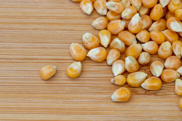 corn kernels for popcorn on a wooden board