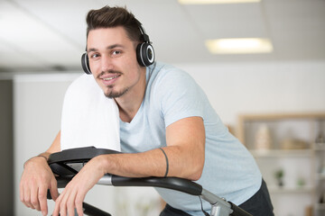 handsome man on step machine in fitness center