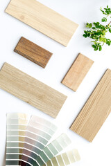 Color scheme with samples of material - kitchen countertops and wooden cabinet. Flat lay